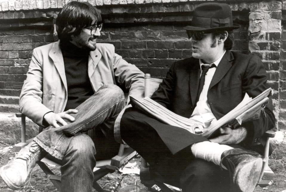 John Landis and Dan Aykroyd confer on the script they cowrote for "The Blues Brothers."