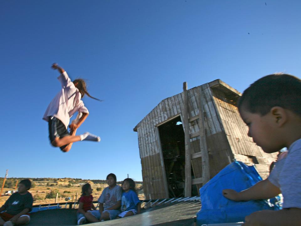 Children play at Church Rock, where dangerously high levels of gamma rays had been found.