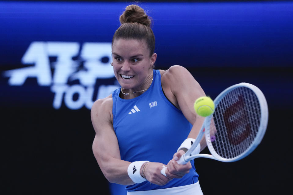Maria Sakkari of Greece makes a backhand return to Daniela Seguel of Chile during their United Cup tennis match in Sydney, Australia, Tuesday, Jan. 2, 2024. (AP Photo/Mark Baker)