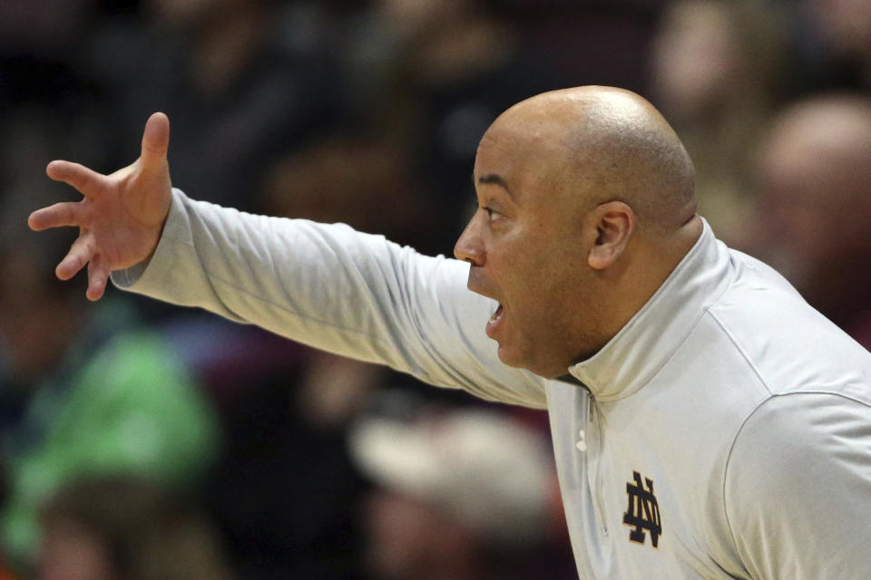 Notre Dame's Micah Shrewsberry instructs his team in the first half of an NCAA college basketball game against Virginia Tech in Blacksburg, Va., Saturday, March 9, 2024. (Matt Gentry/The Roanoke Times via AP)