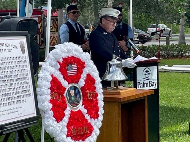 Michael Moody, retired New York Fire Department, speaks at Palm Bay's 9/11 Patriot Day memorial Sunday outside City Hall.