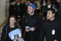 CORRECTS DATE - Los Angeles Dodgers' Gavin Lux, center, walks with his fiancee Molly O'Boyle, left, during the baseball team's arrival at Incheon International Airport, Friday, March 15, 2024, in Incheon, South Korea, ahead of the team's baseball series against the San Diego Padres. (AP Photo/Lee Jin-man)