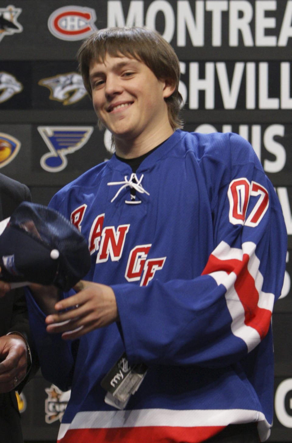 FILE - Alexei Cherepanov, of Russia, smiles after being selected by the New York Rangers during the first round of the NHL hockey draft on June 22, 2007, in Columbus, Ohio. Cherepanov died Oct. 13, 2007, during a game in Russia. He was 19. The horror that swept across the NFL when Buffalo BIlls defensive back Damar Hamlin collapsed and went into cardiac arrest during a game this week in Cincinnati was all too familiar to members of the hockey community. (AP Photo/Jay LaPrete, File)