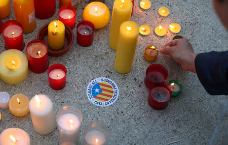 Members of the Committee for the Defence of the Republic (CDR) light candles in memory of jailed Catalonian politicians at Catalunya square in Barcelona, Spain April 27, 2018. REUTERS/Albert Gea