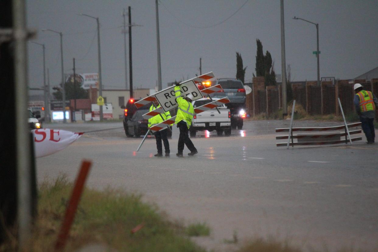 First responders enforced road closures on several south Lubbock roadways after heavy rainfall created flash flooding Tuesday evening.