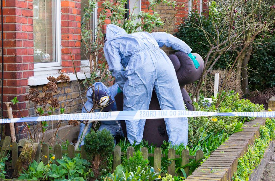 <em>Police search for evidence at the home of Ms Garcia-Bertaux following the discovery of her body (SWNS)</em>