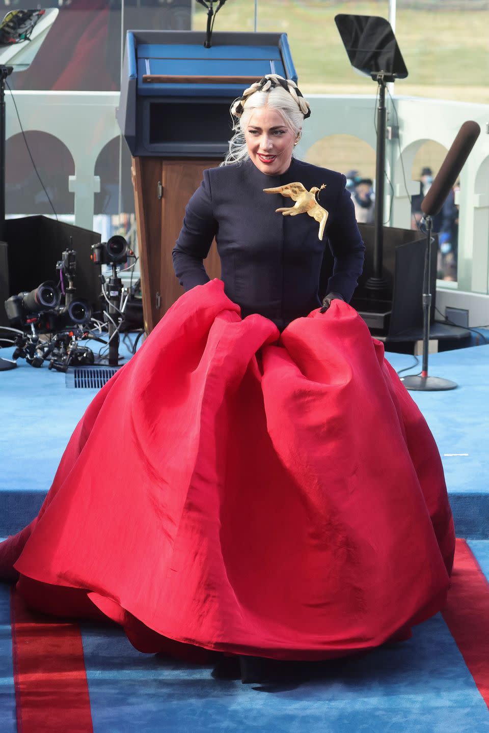 <p>Lady Gaga performed the National Anthem wearing a dramatic Schiaparelli gown, <a href="https://www.harpersbazaar.com/uk/fashion/fashion-news/a35267615/lady-gaga-schiaparelli-inauguration-gown/" rel="nofollow noopener" target="_blank" data-ylk="slk:which was designed to be a "love letter" to the US.;elm:context_link;itc:0;sec:content-canvas" class="link ">which was designed to be a "love letter" to the US.</a></p>