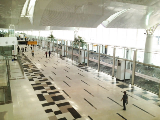 That new airport smell: Workers and local officials are walking to and fro at the new Kuala Namu International Airport near Medan, North Sumatra. (