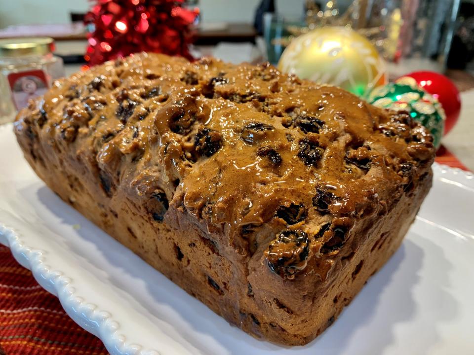 A traditional Welsh Bara Brith loaf, filled with dried fruits and glazed with honey.