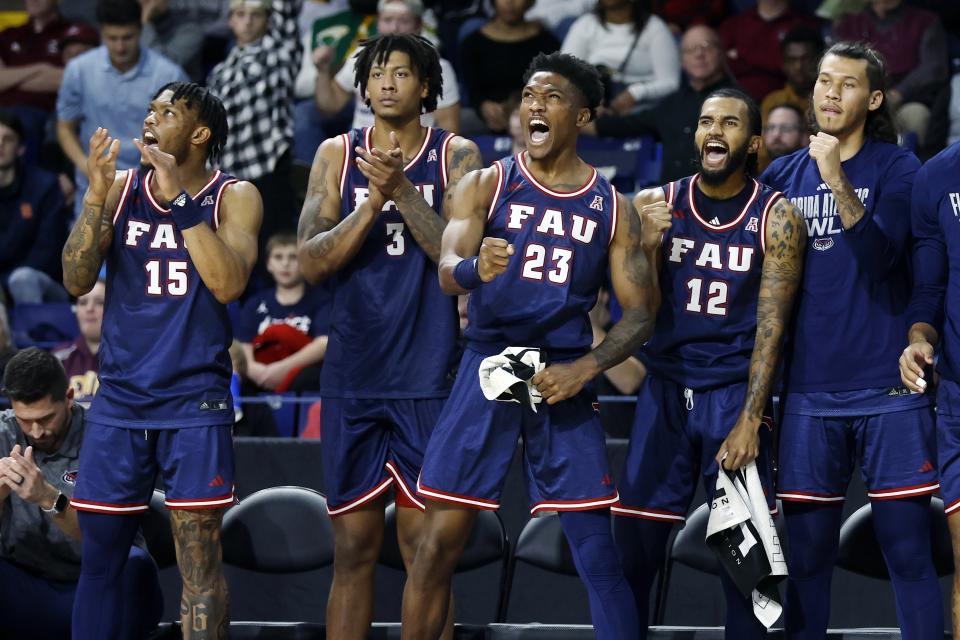 FILE - The Florida Atlantic bench reacts during the second half of an NCAA college basketball game against the St. Bonaventure in the Basketball Hall of Fame Classic, Saturday, Dec. 16, 2023, in Springfield, Mass. College basketball is undergoing a shift, a new era ushered in by the transfer portal, NIL and conference realignment. Teams like Buffalo, Furman, Wofford and Florida Atlantic have been ranked for the first time in the past five years. (AP Photo/Michael Dwyer, File)