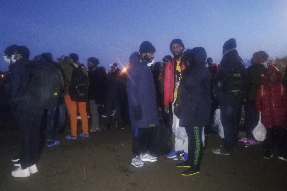 Migrants walk to the border gate of Pazarkule in Edirne, near Turkey-Greece border, early Friday, Feb. 28, 2020. An air strike by Syrian government forces killed scores of Turkish soldiers in northeast Syria, a Turkish official said Friday, marking the largest death toll for Turkey in a single day since it first intervened in Syria in 2016. (IHA via AP)