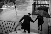 <p>Spencer Leak Sr greets a woman outside a funeral at at the New Life Center Church COGIC on Chicago’s south side. (Photo: Jon Lowenstein/NOOR for Yahoo News) </p>