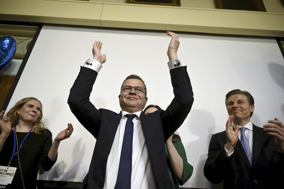 The National Coalition party Chairman Petteri Orpo, center, celebrates at the party's parliament election party at the Ostrobotnia club in Helsinki, Finland on Sunday, April 2, 2023. Finland’s center-right National Coalition Party claimed victory with 94.2% of votes counted in an extremely tight three-way parliamentary race. They appeared to beat the ruling Social Democrats led by Prime Minister Sanna Marin. (Antti Aimo-Koivisto/Lehtikuva via AP)