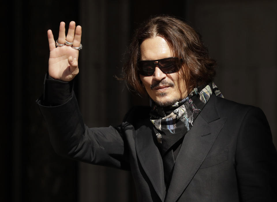 Actor Johnny Depp arrives at the High Court in London, Monday, July 20, 2020. Amber Heard started Monday to give evidence at the High Court in London as part of Johnny Depp’s libel case against The Sun over allegations of domestic violence during the couple's relationship. (AP Photo/Matt Dunham)