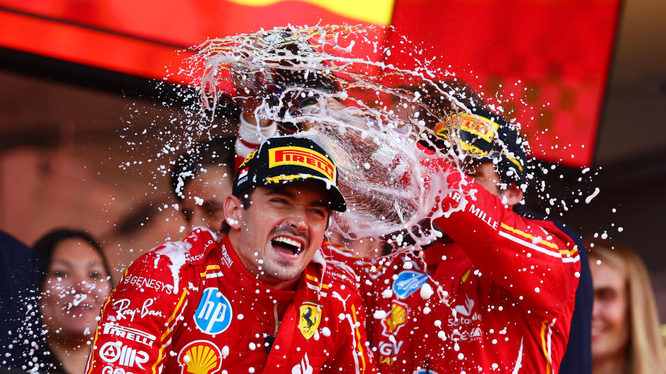 Leclerc and third-place finisher Carlos Sainz celebrate on the podium. (Bryn Lennon/Formula 1 via Getty Images)