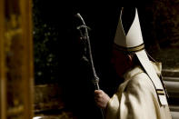 Pope Francis leaves at the end of a consistory ceremony where 13 bishops were elevated to a cardinal's rank in St. Peter’s Basilica at the Vatican, Saturday, Nov. 28, 2020. (Fabio Frustaci/POOL via AP)