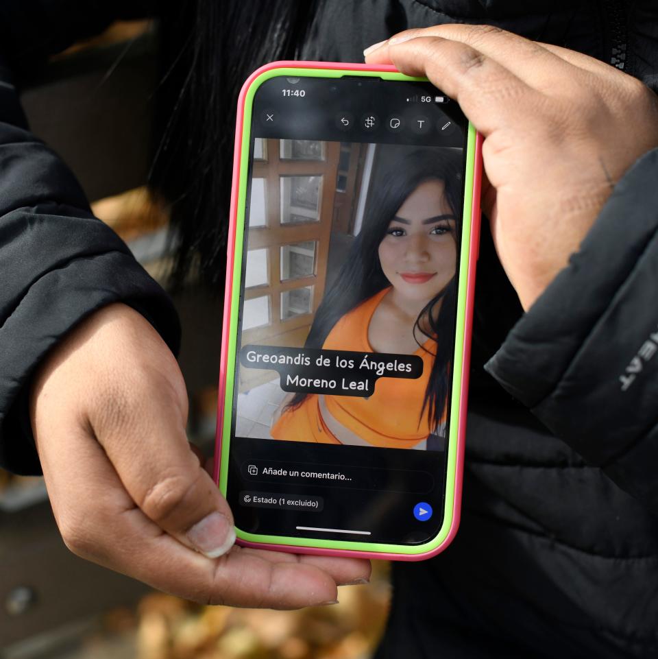 Katiuska Leal Moreno holds a cellphone image of her missing sister in New York City on Nov. 4, 2023. Moreno's mother, Santa Eluminada Moreno; her sister Greoandis de Los Angeles Moreno; and 4-year-old niece Reyshell Moreno went missing after their boat departed Colombia's San Andres island on Oct. 21, 2023, bound for Nicaragua. At least four other boats on the dangerous new migration route have disappeared, according to the Colombian navy.