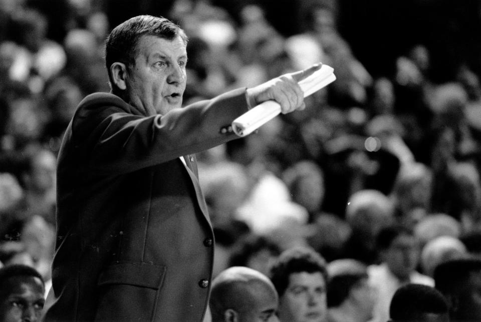 Louisville men's basketball assistant coach Jerry Jones directs players during a game. Jones died Monday at age 89.