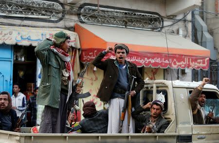 Houthi militants react as they ride on a truck after Yemen's former president Ali Abdullah Saleh was killed, in Sanaa, Yemen December 4, 2017. REUTERS/Khaled Abdullah