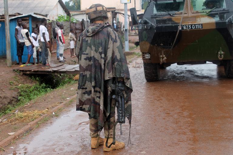French soldiers from the European Union's Eufor mission patrol in a street of the PK5, the last remaining Muslim district in Bangui on August 21, 2014