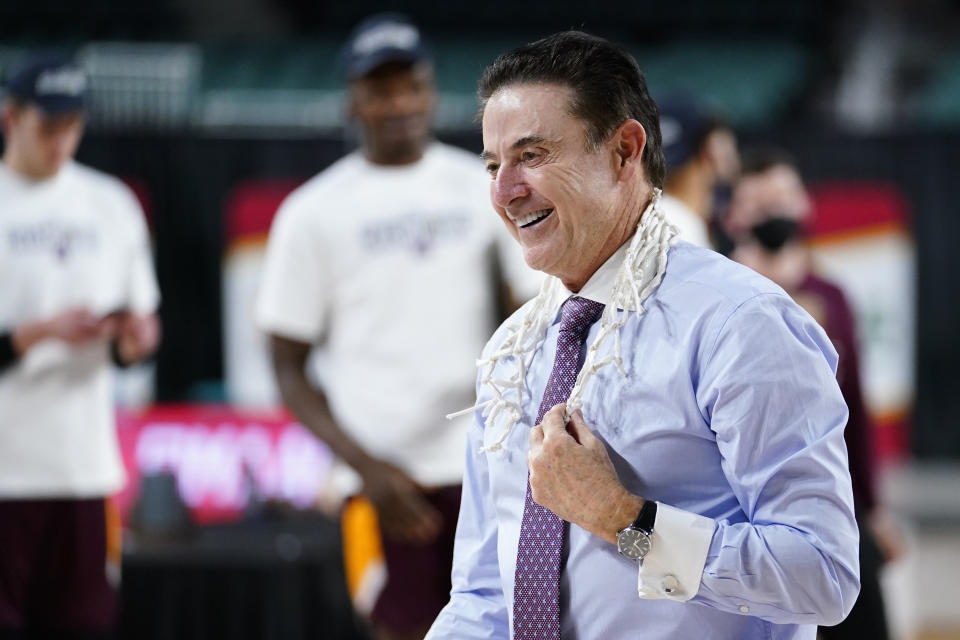 FILE - Iona head coach Rick Pitino celebrates after Iona won an NCAA college basketball game against Fairfield during the finals of the Metro Atlantic Athletic Conference tournament in Atlantic City, N.J., in this Saturday, March 13, 2021, file photo.Rick Pitino survived sex scandals and FBI investigations , won national championships , and when his coaching options seemingly dried up , he left for Greece. Somehow , the winding road of his career took him to Iona - and back in the NCAA Tournament. The last stop - he swears it’s true - of his career. (AP Photo/Matt Slocum, File)