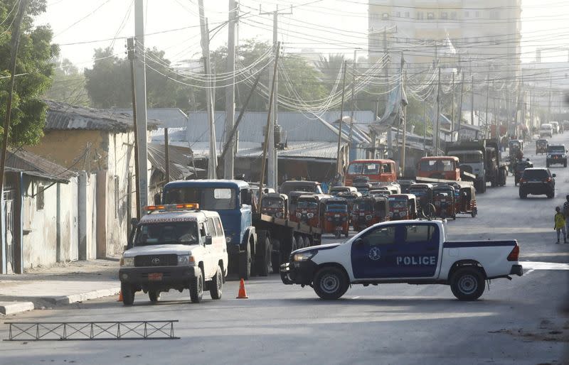 FILE PHOTO: Somali security forces secure the street near the scene of a militant attack at a building in Abdias district of Mogadishu