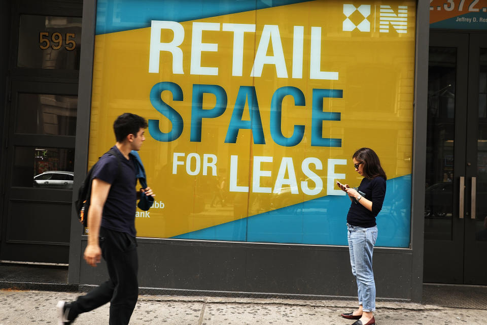 NEW YORK, NY - APRIL 17:  People walk by empty retail space in lower Manhattan on April 17, 2017 in New York City. As American's shopping habits continue to migrate online, brick-and-mortar stores across the country are closing at an increased rate. For the first time in nearly two years, retail sales declined two months in a row according to recently released figures from the Commerce Department. Millennials, who often prefer Amazon and other online businesses, are also putting more of their money into vacations and restaurants instead of merchandise.  (Photo by Spencer Platt/Getty Images)