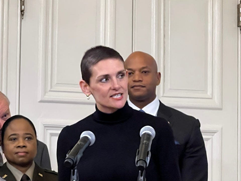 Maryland Department of Information Technology Secretary Katie Savage, center, speaks about new digital initiatives for the state in Annapolis on January 8, 2023. At left, Major General Janeen Birckhead and at right, Gov. Wes Moore look on.