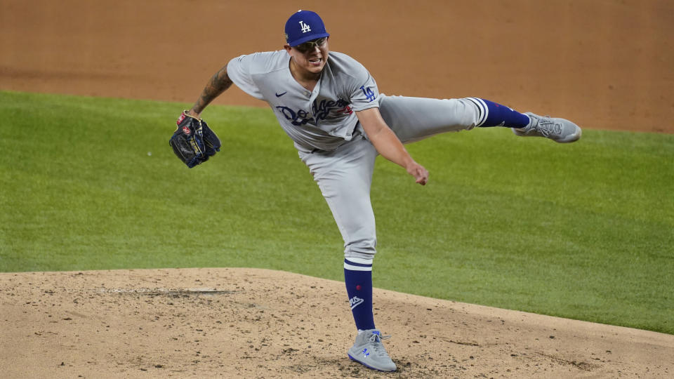 Los Angeles Dodgers' Julio Urias delivers to the San Diego Padres during the second inning in Game 3 of a baseball National League Division Series Thursday, Oct. 8, 2020, in Arlington, Texas. (AP Photo/Tony Gutierrez)