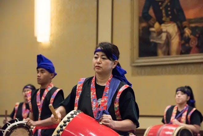 The Fayetteville Okinawa Kenjinkai perform during an annual Asian Pacific Heritage Month observance at Fort Bragg.