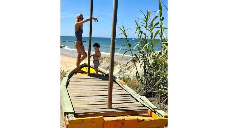 mother with son standing in boat 