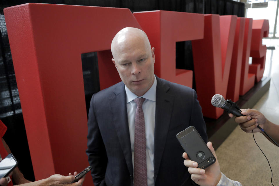 New Jersey Devils coach John Hynes, talks to reporters following a news conference introducing Jack Hughes, the No. 1 overall pick in the 2019 NHL hockey draft, Tuesday, June 25, 2019, in Newark, N.J. (AP Photo/Julio Cortez)