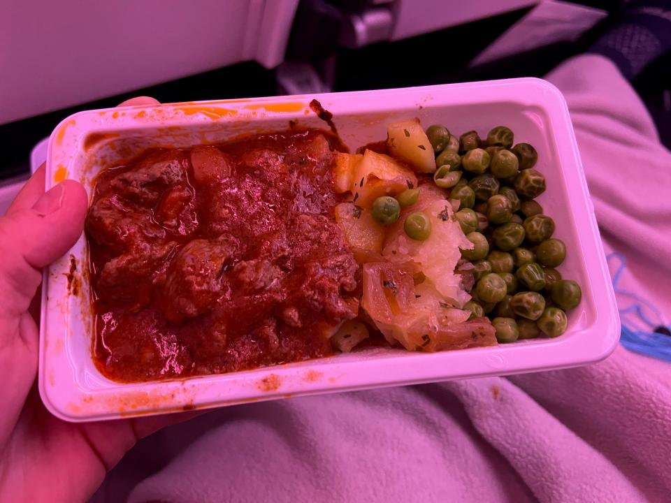 The lamb with potatoes and peas.