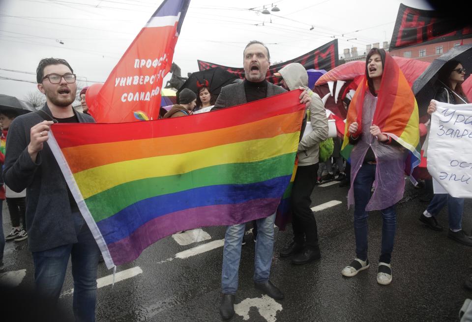 FILE - Advocate and founder of the Russian LGBT Network rights group Igor Kochetkov, center, and other activists attend a May Day rally in St. Petersburg, Russia, Tuesday, May 1, 2018. Russia’s Supreme Court on Thursday, Nov. 30, 2023, effectively outlawed LGBTQ+ activism, in the most drastic step against advocates of gay, lesbian and transgender rights in the increasingly conservative country. (AP Photo, File)