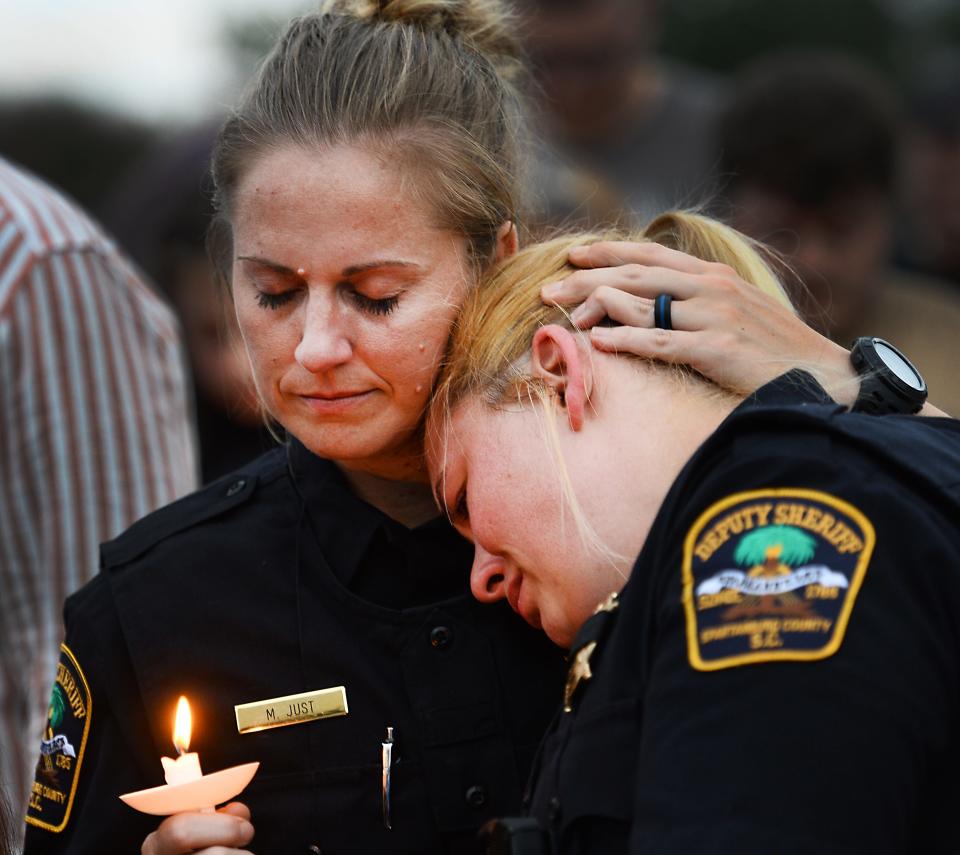 A candlelight memorial was held on June 22 at the Spartanburg County Sheriff’s Office for deputy Austin Aldridge. Deputy Austin Derek Aldridge, 25, died Tuesday from injuries sustained in a shooting that resulted from a response to a domestic call.  Spartanburg County Sheriff’s M. Just, left, and another deputy take a moment at the service. 