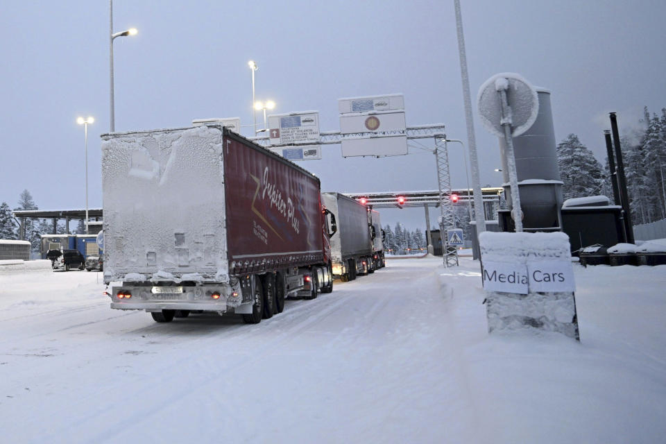 Trucks line up at the Raja-Jooseppi international border crossing station with Russia, in Inari, northern Finland, on Tuesday, Nov. 28, 2023. Finland will close its last remaining road border with Russia due to concerns over migration, Prime Minister Petteri Orpo said Tuesday, accusing Moscow of undermining Finland's national security. Finland already closed seven of its eight of the checkpoints along its long border Russia this month following a surge in arrivals of migrants from the Middle East and Africa. The government accuses Moscow of ushering the migrants toward the Finnish border. (Emmi Korhonen/Lehtikuva via AP)