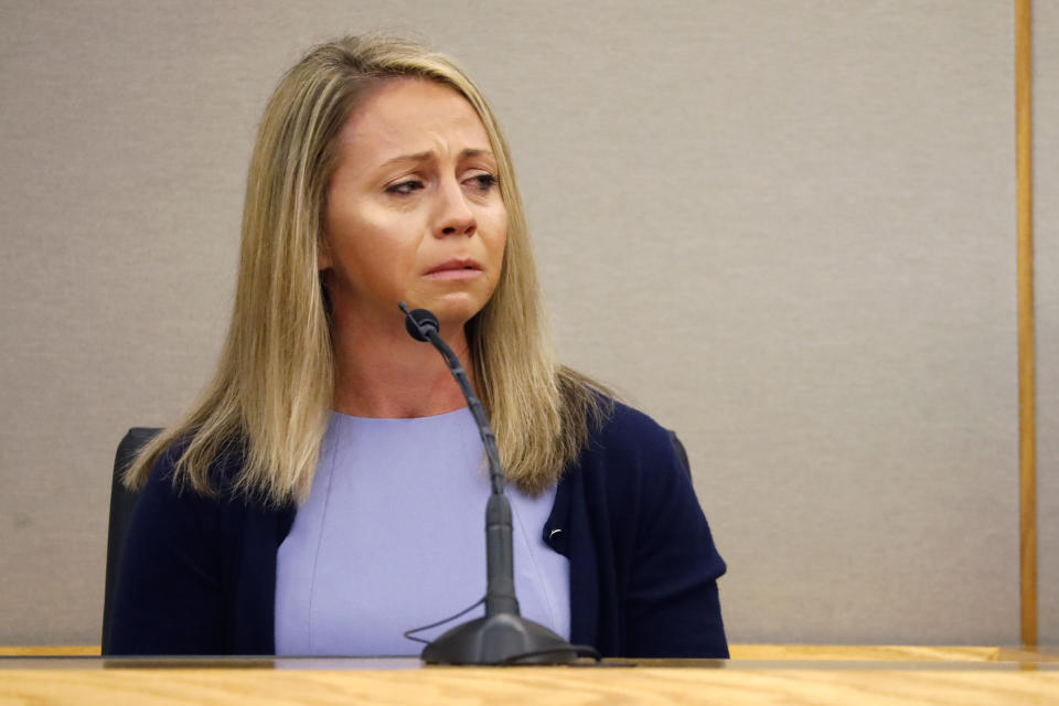 FILE - In this Friday, Sept. 27, 2019, file pool photo, fired Dallas police officer Amber Guyger becomes emotional as she testifies in her murder trial in Dallas. Guyger, who said she fatally shot her unarmed, black neighbor after mistaking his apartment for her own was found guilty of murder on Tuesday, Oct. 1, 2019. A jury reached the verdict in the high-profile trial for the killing of Botham Jean after six days of witness testimony but just a handful of hours of deliberation. (Tom Fox/The Dallas Morning News via AP, Pool, File)