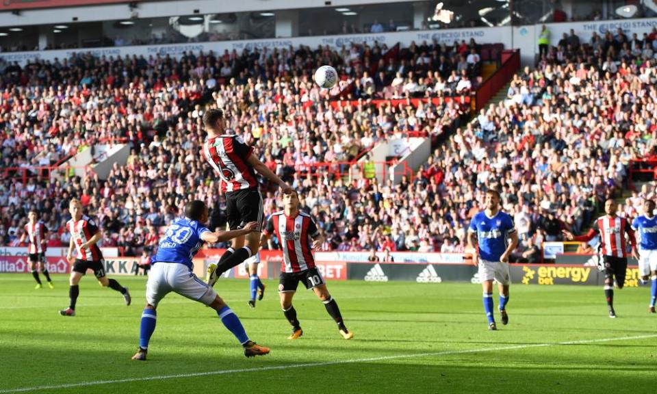 Chris Basham leaps to power Sheffield United in front against Ipswich at Bramall Lane. 