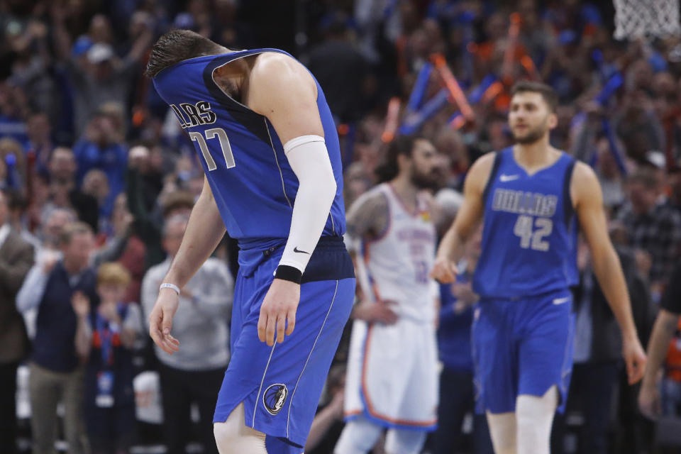 Dallas Mavericks forward Luka Doncic (77) pulls his jersey over his face after missing a shot late in the second half of the team's NBA basketball game against the Oklahoma City Thunder on Tuesday, Dec. 31, 2019, in Oklahoma City. (AP Photo/Sue Ogrocki)