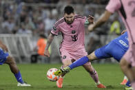 Inter Miami's Lionel Messi is fouled by Monterrey Sergio Canales during a CONCACAF Champions Cup quarter final second leg soccer match at the BBVA stadium in Monterrey, Mexico, Wednesday, April 10, 2024. (AP Photo/Eduardo Verdugo)