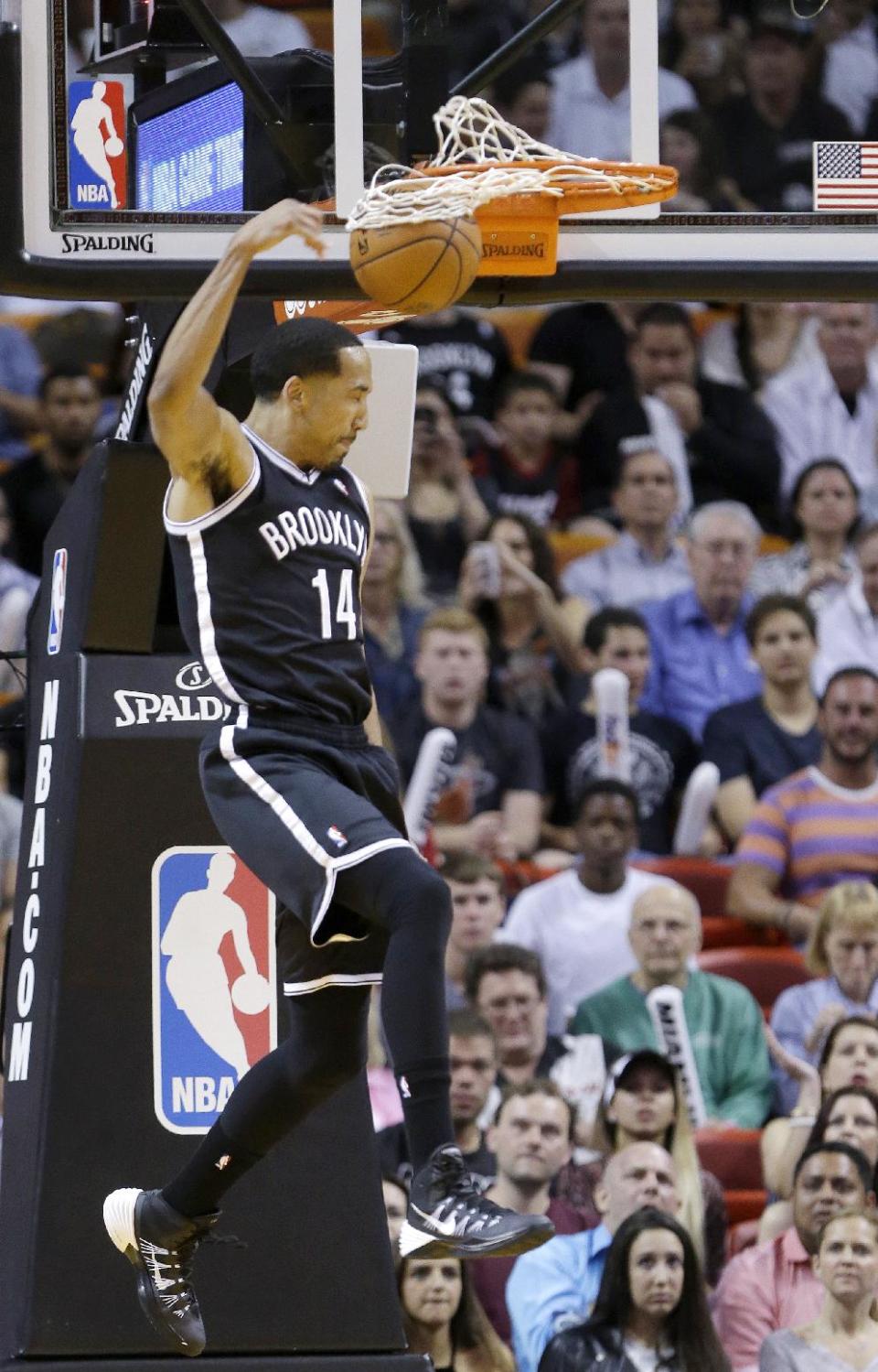 Brooklyn Nets guard Shaun Livingston dunks the ball during the first half of an NBA basketball game against the Miami Heat, Tuesday, April 8, 2014 in Miami. (AP Photo/Wilfredo Lee)