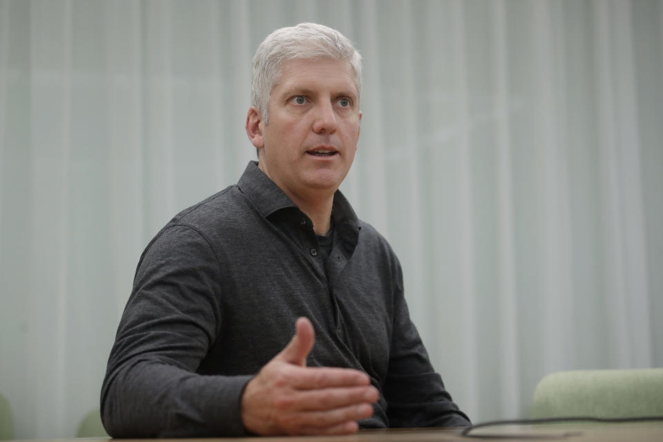 In this Tuesday, Sept. 24, 2019, photo Rick Osterloh, SVP of Google Hardware gestures while interviewed in Mountain View, Calif. (AP Photo/Jeff Chiu)