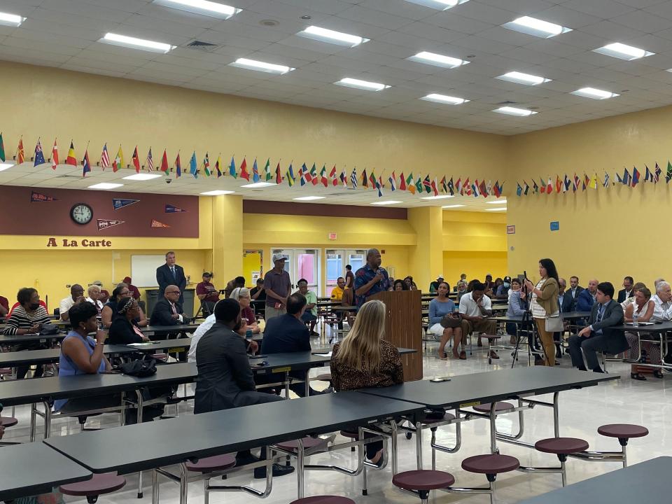 A speaker addresses Superintendent Mike Burke and school board member Edwin Ferguson on Wednesday, Aug. 25 at a meeting regarding historic Roosevelt High School in West Palm Beach.