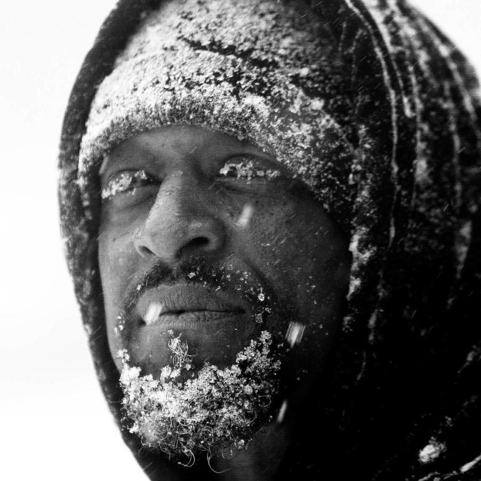 Snow clings to Turron Williams’ beard and eyelashes Wednesday, February 11, 2014 on Hammond Road as snow pounds the Triangle. Williams was helping push cars stuck in the snow. TRAVIS LONG/tlong@newsobserver.com