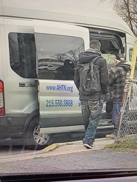 Two men are pictured boarding the van used by the Advocates for the Homeless and Those in Need to transport the homeless to nightly meals. The van was damaged in a two-vehicle accident Friday night in Fallsington, police said.