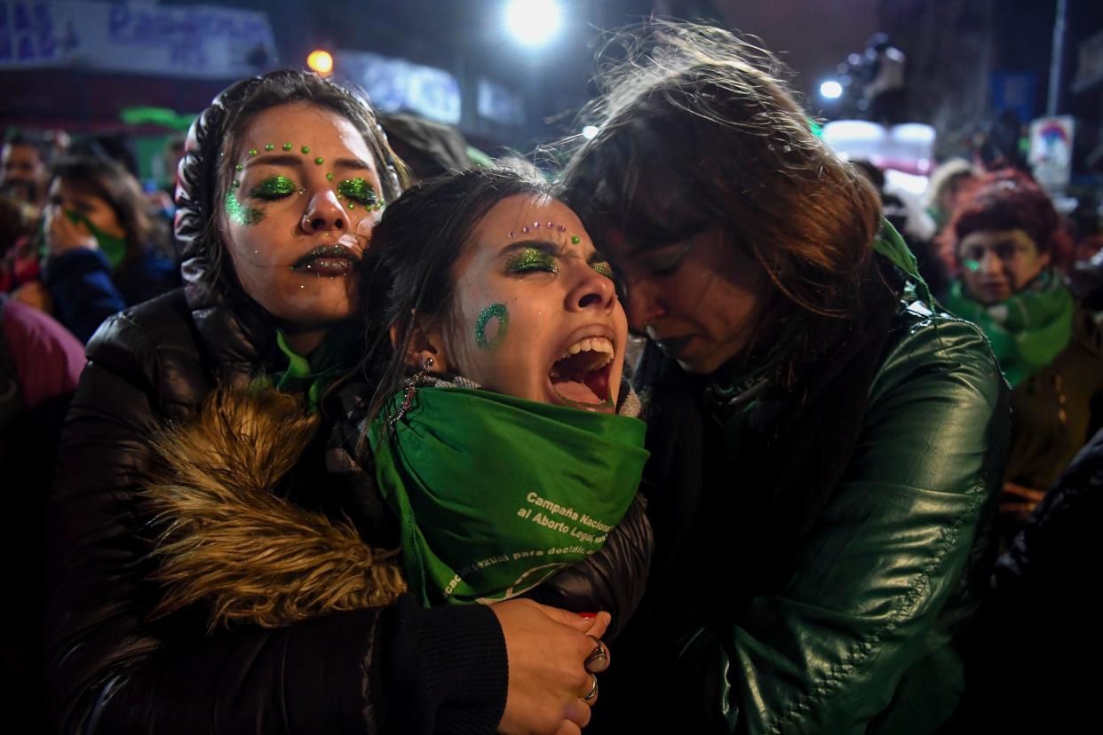 Activists in favor of the legalization of abortion comfort each other outside the National Congress in Buenos Aires on Aug. 9&nbsp;after senators rejected an abortion bill. (Photo: EITAN ABRAMOVICH/Getty Images)