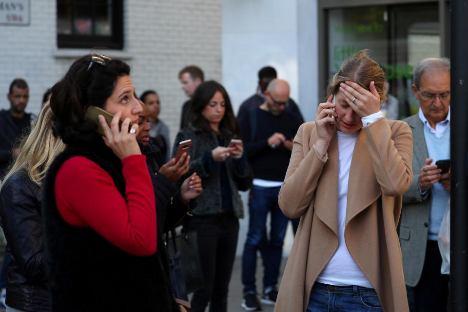 <p>People react near Parsons Green tube station in London, Britain, Sept. 15, 2017. (Photo: Hannah McKay/Reuters) </p>