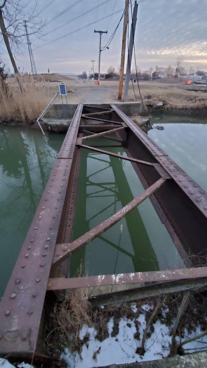 These are the tracks of the Toledo, Ottawa Beach and Northern Railway Interurban line bridge as it spans Whitewood Creek, known today as LaPointe Drain.  The rail line ran through Luna Pier over to the Toledo Beach Amusement Park and operated during the first two decades of the 20th century.