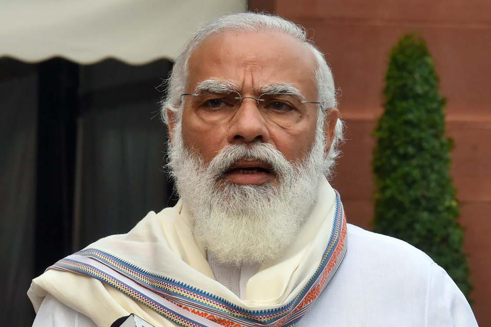 FILE - In this Sept.14, 2020, file photo released by India Government Press Information Bureau, Indian Prime Minister Narendra Modi addresses the media as he arrives at the Parliament in New Delhi, India. Modi held his first phone conversation with U.S. President-elect Joe Biden, and they agreed to work closely to further advance the Indo-U.S. comprehensive global strategic partnership, India’s External Affairs Ministry said Wednesday, Nov. 18, 2020. (India Government Press Information Bureau via AP, File)