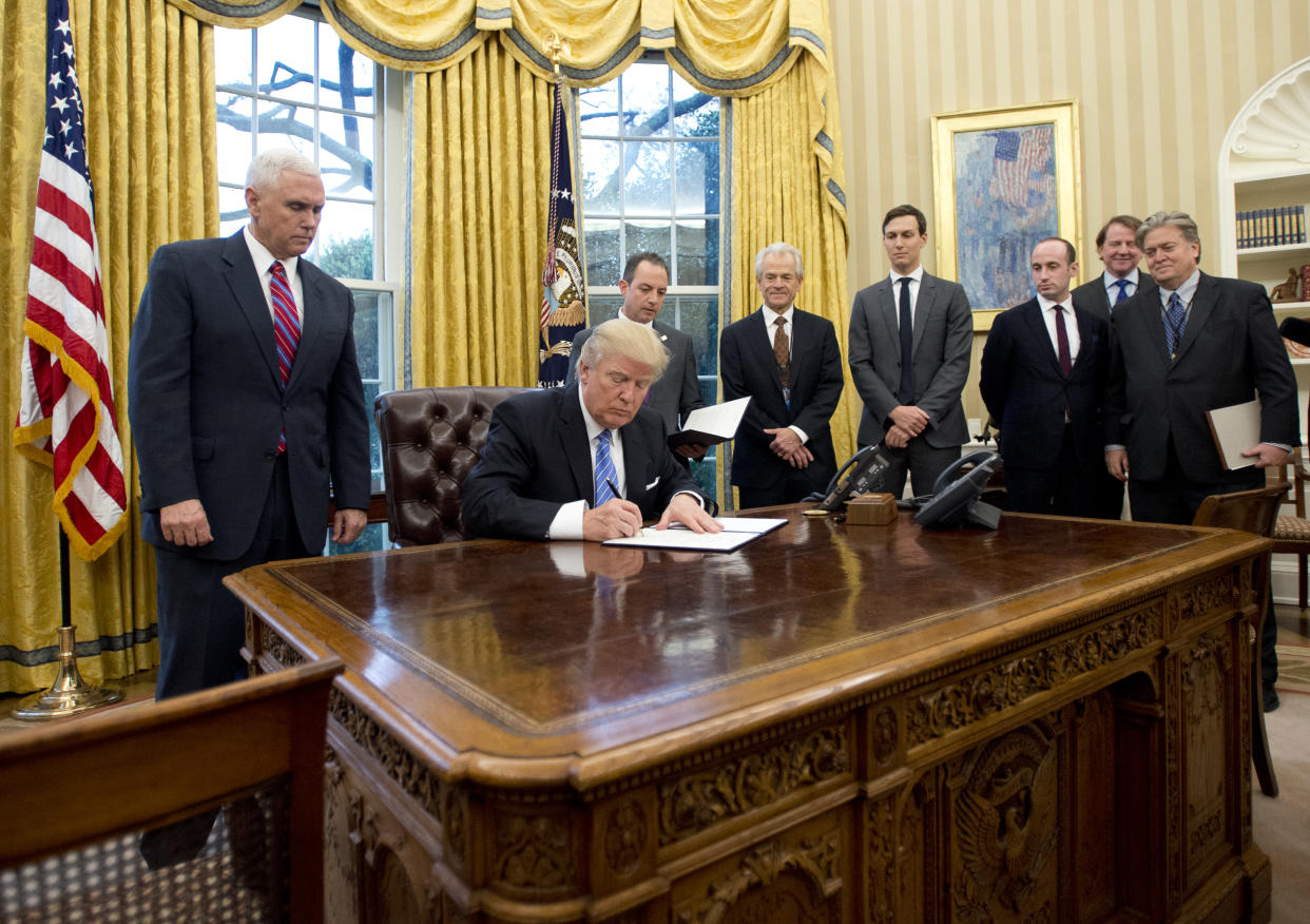 President Donald Trump signing an executive order in 2017